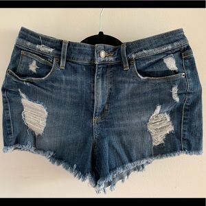 Distressed denim high-waisted shorts